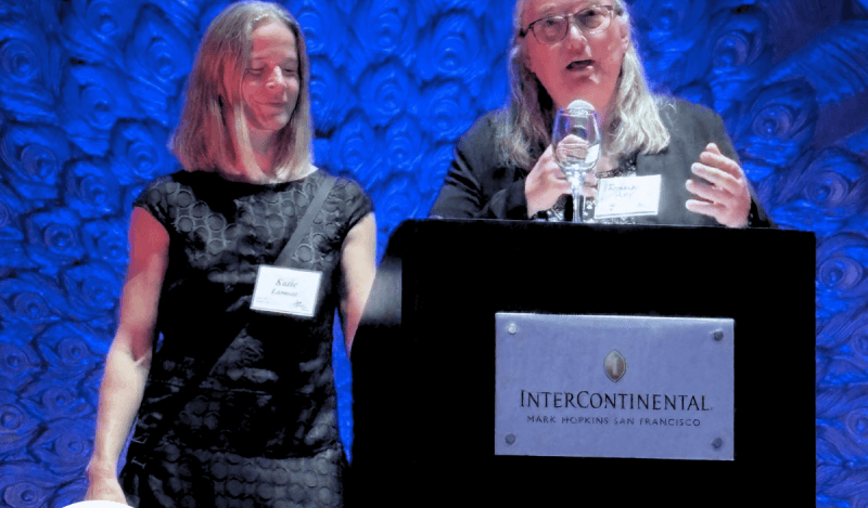 Roxanne Huey and Katie Lamont accept award from Curry Center