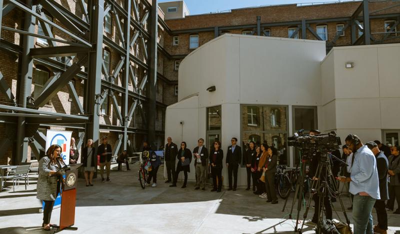 TNDC celebrates Ambassador and Rits grand opening with city officials