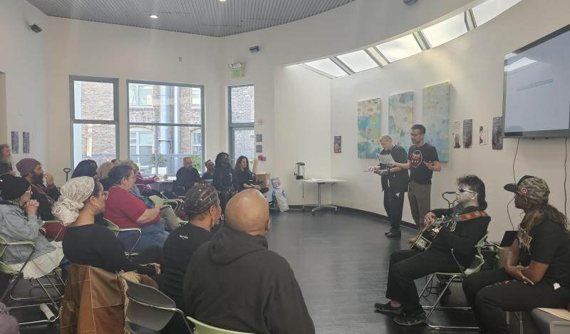 Kevin Liu introducing SHOPN to TNDC residents