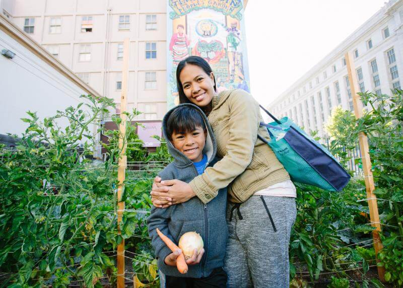 boy and woman in garden