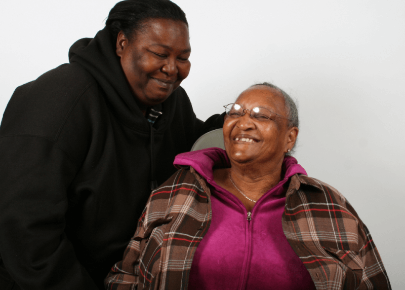 elder smiling with friend